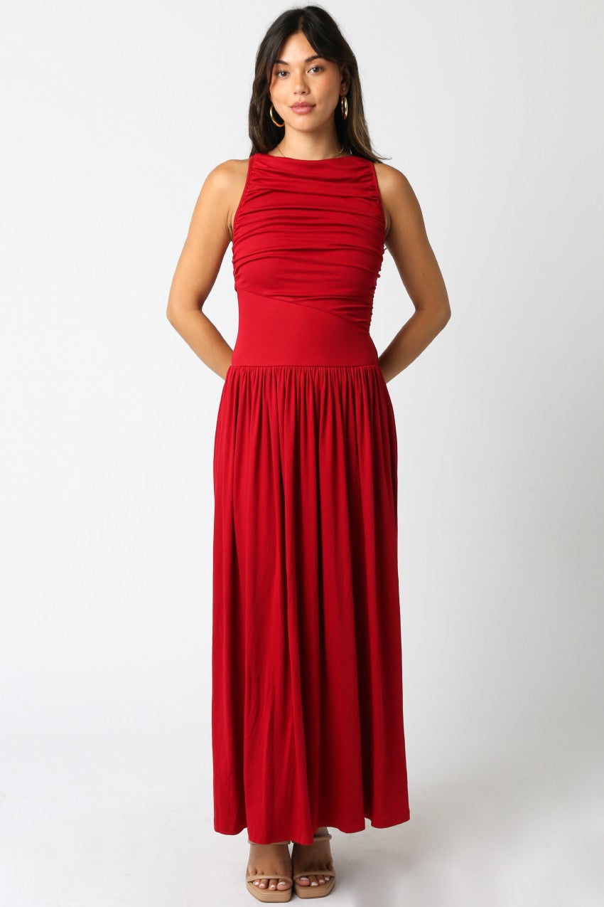 Woman wearing a red dress against a white background