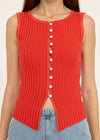 Red ribbed tank top with button details worn by a person, against a neutral background