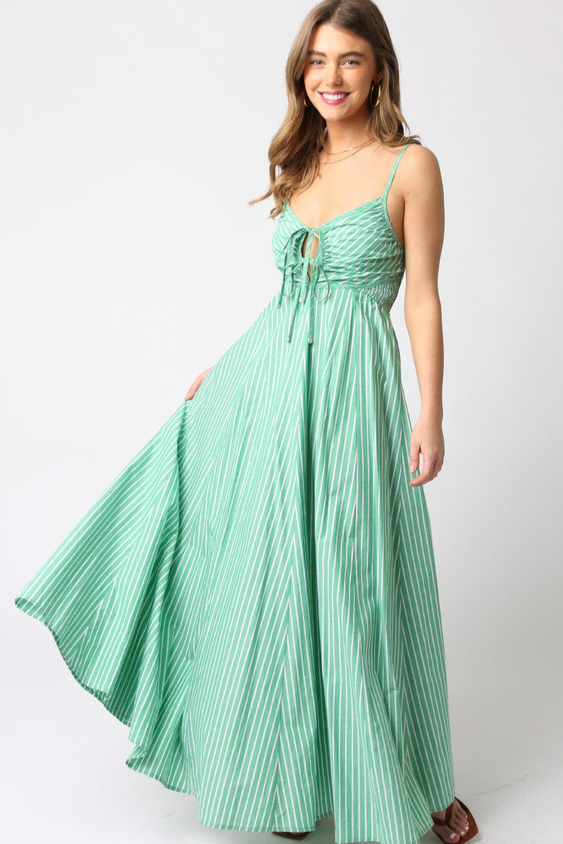 Woman wearing a green dress with a white background