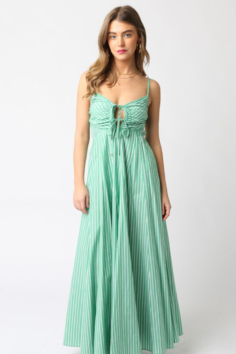 Woman wearing a mint green dress on a white background